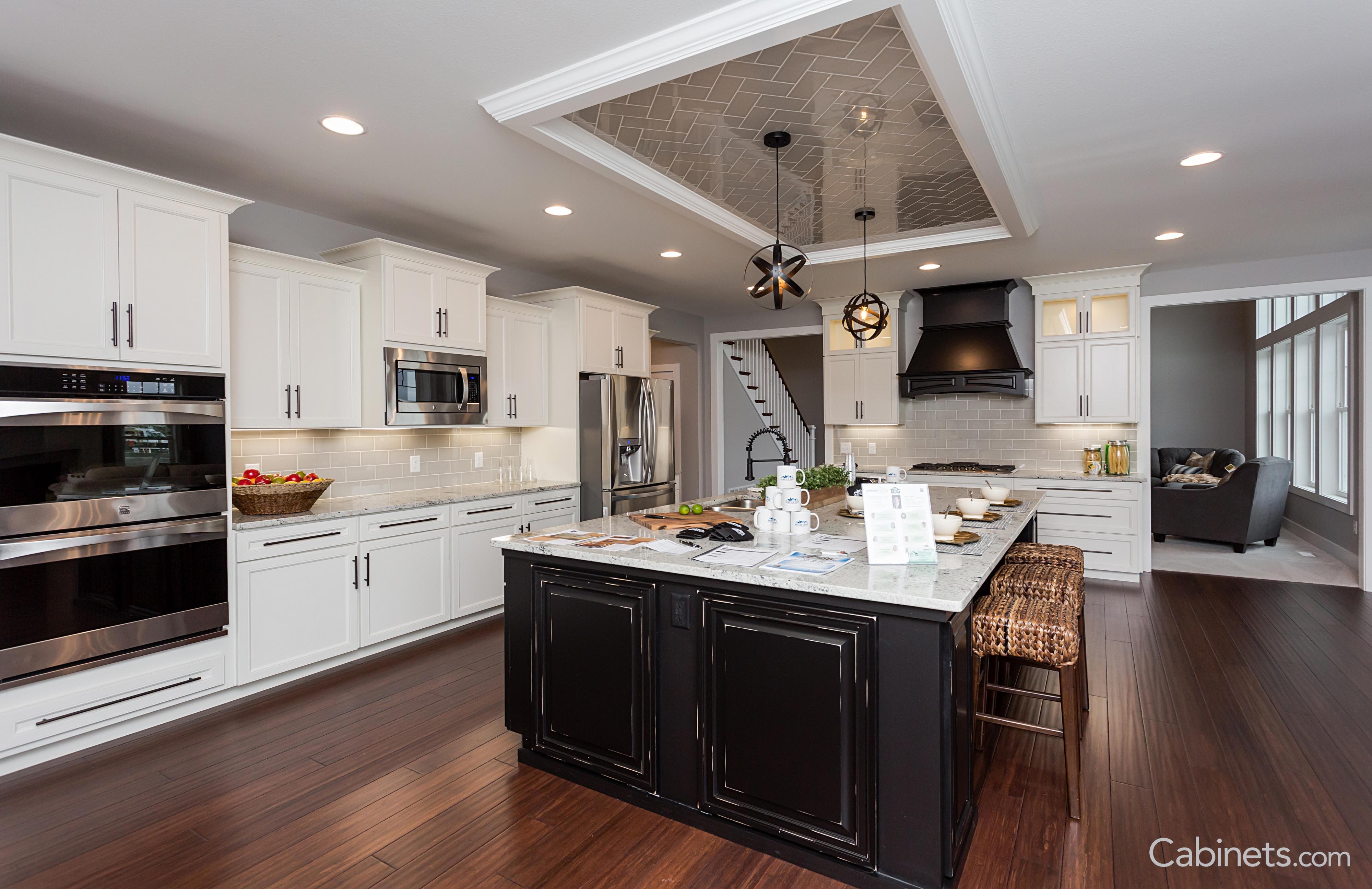 Shaker white cabinets with a black island