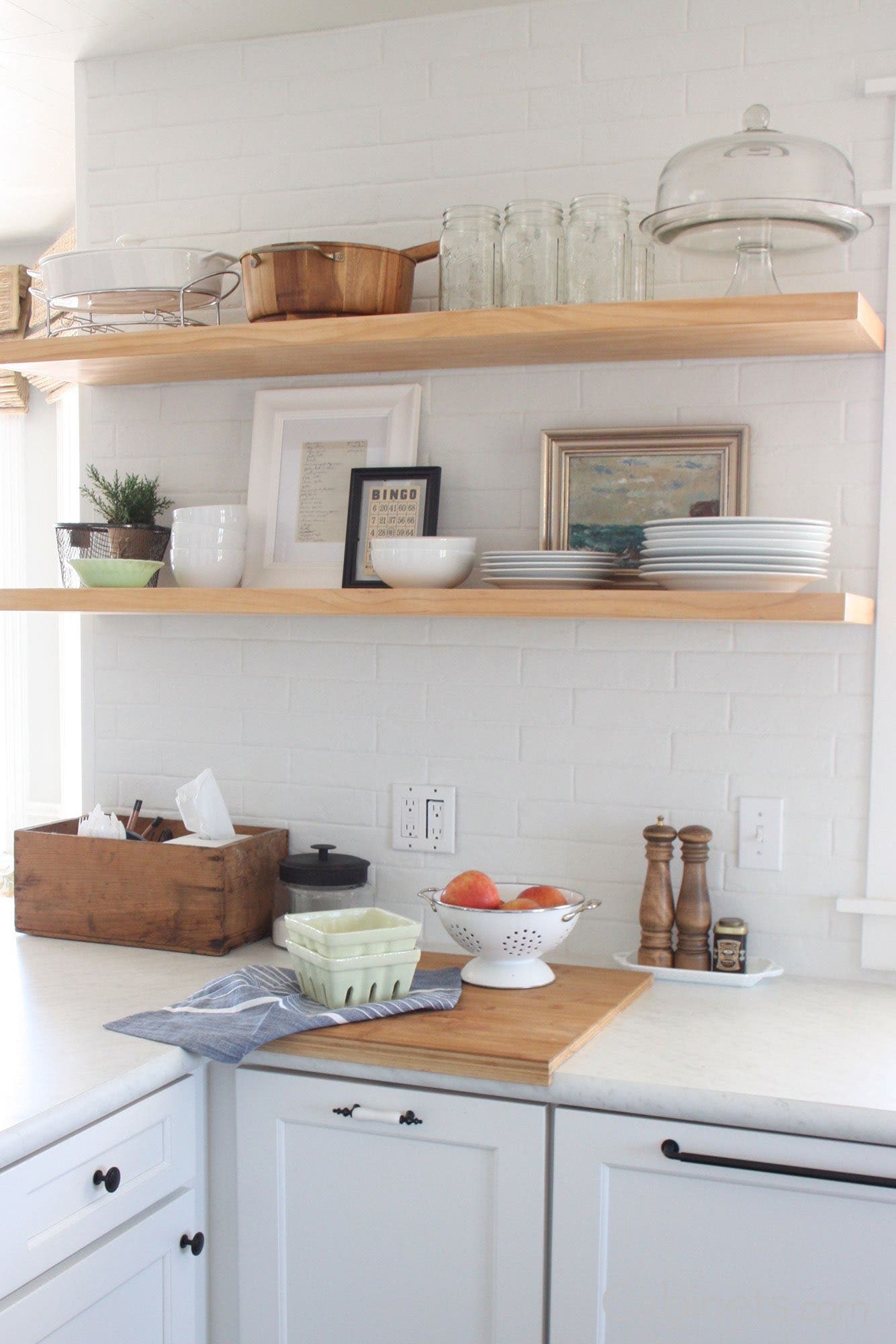 Floating shelves over Sebring Maple Bright White cabinets