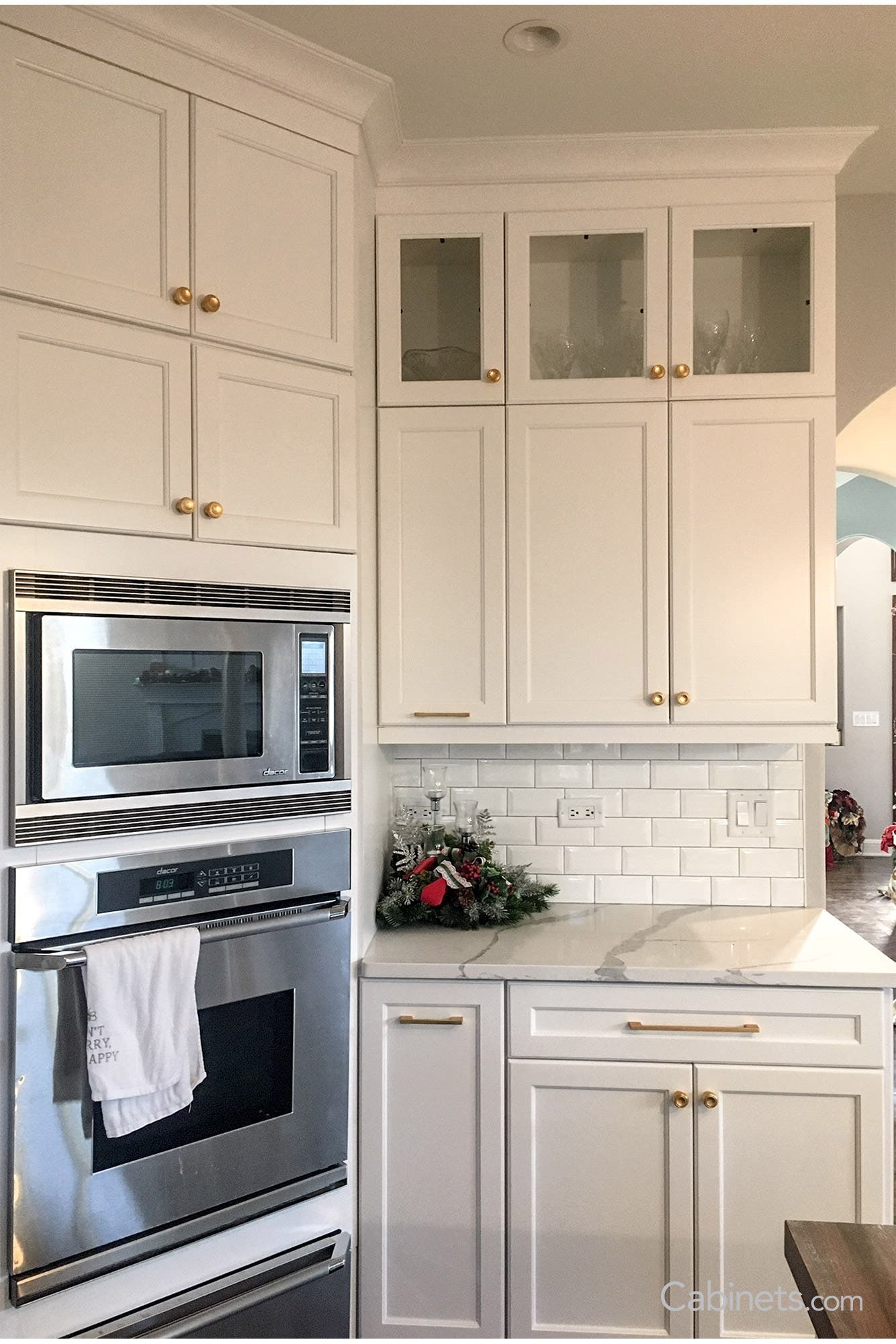 Gold hardware on Lombard Maple Bright White customer kitchen cabinets