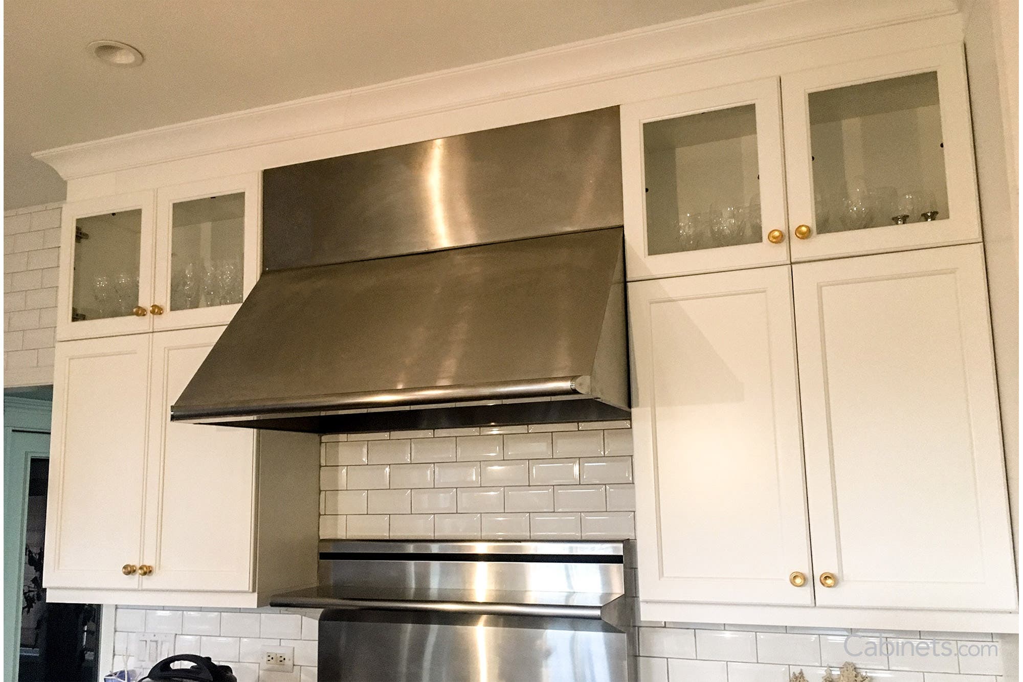 Glass doors installed in Bright White Lombard kitchen cabinets