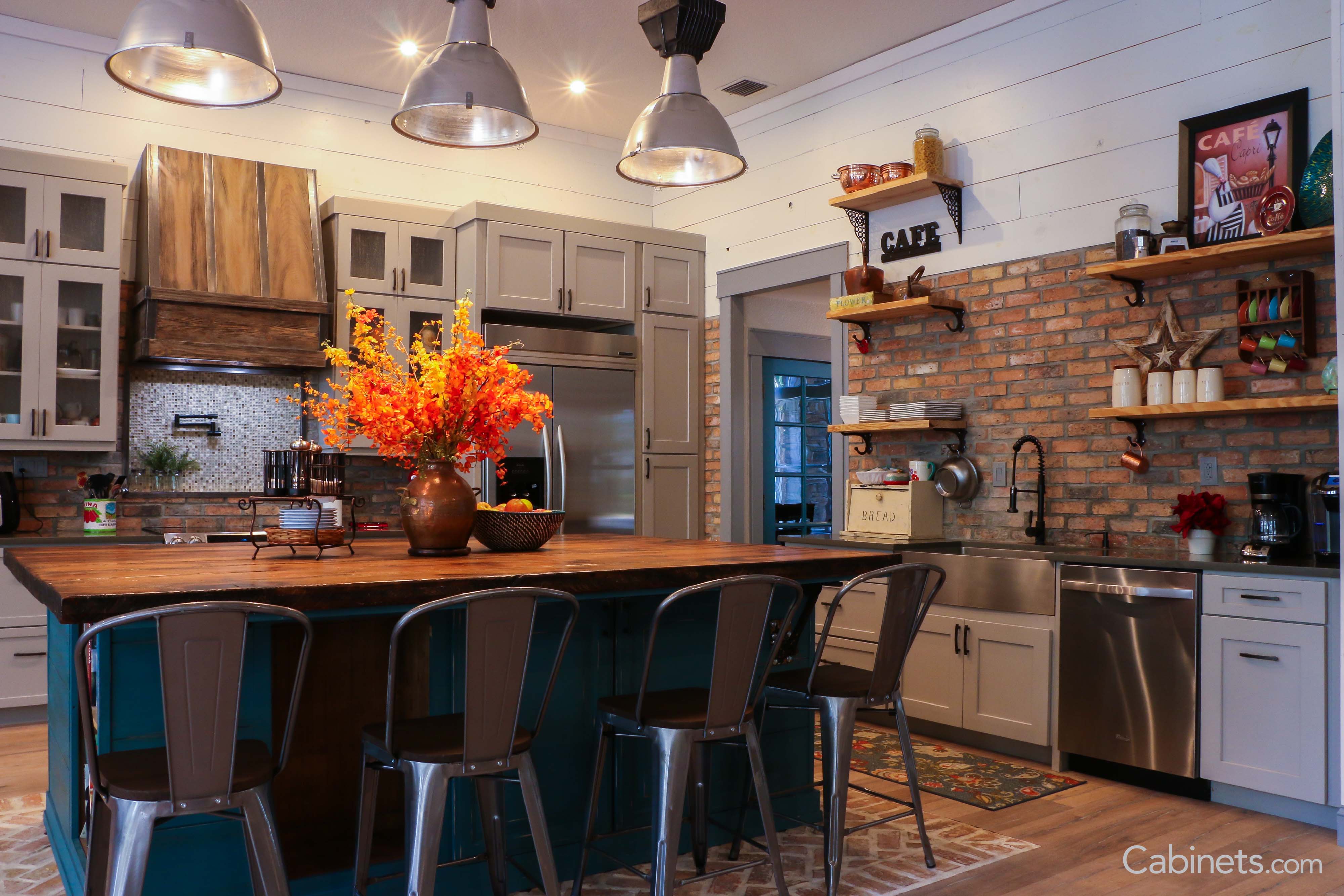 Contrasting blue island with Shaker II Maple Willow Gray cabinetry surrounding