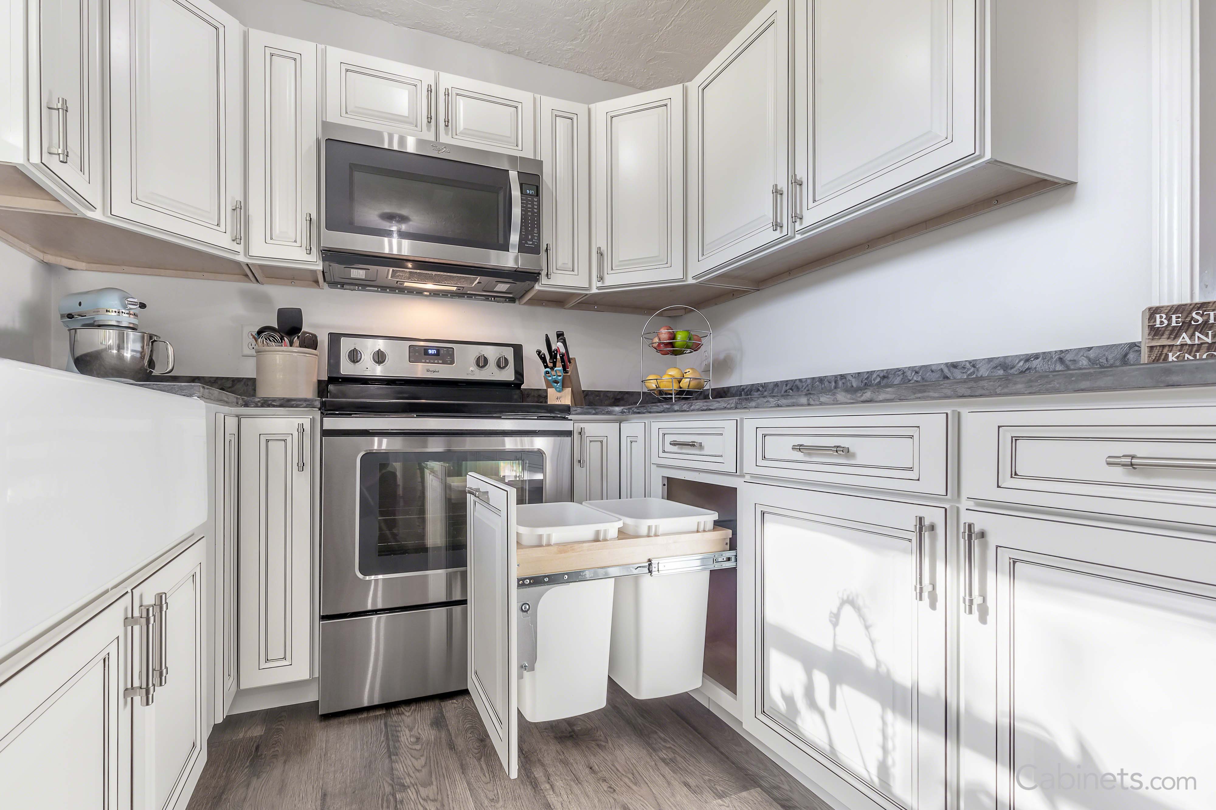 Antique white cabinets with trash pull out