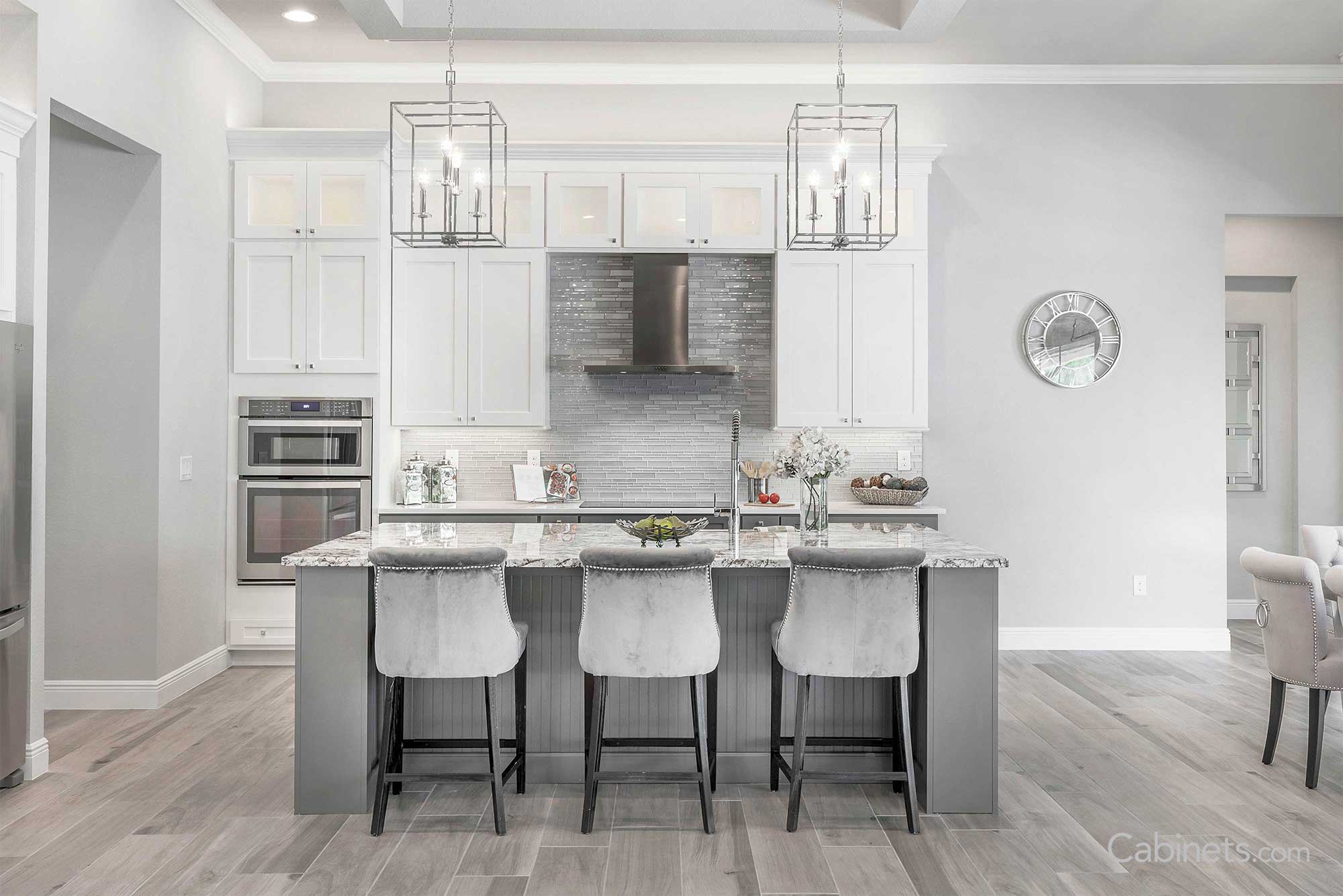 Simple square pendant lights over a grey island