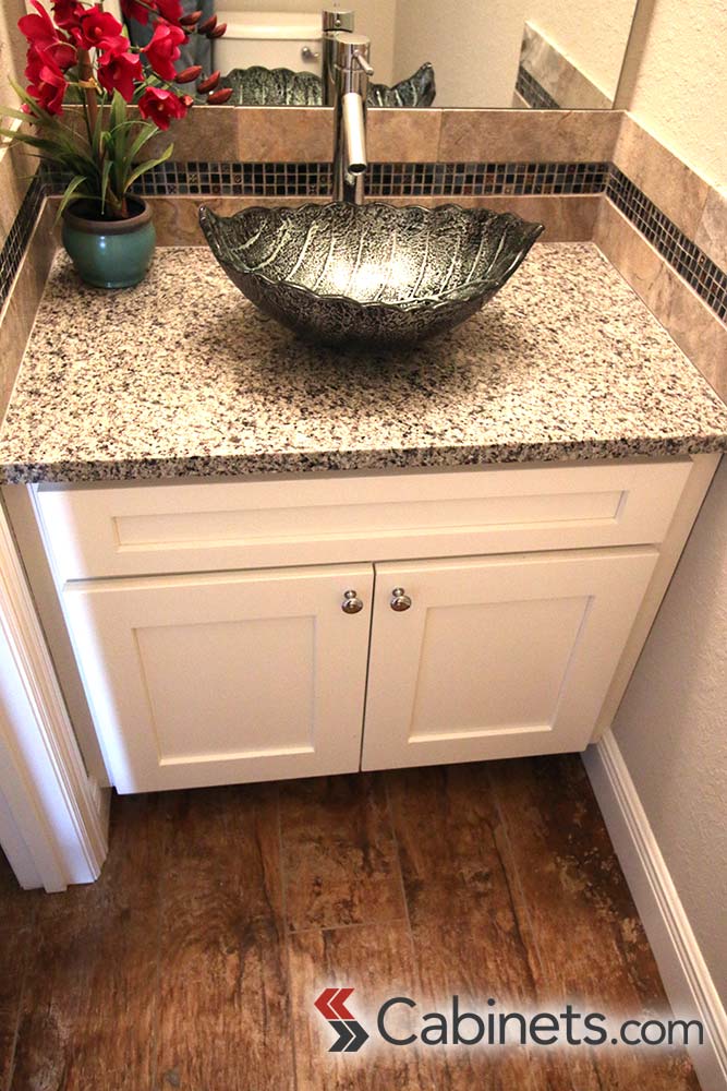 This vanity may be small but it makes up for its size with style! Our customer added a unique vessel sink to make the bathroom stand out!