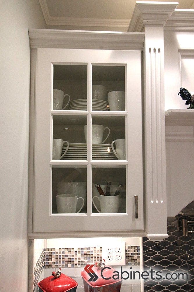 Our customer added the right amount of simplicity with all white dinnerware displayed in their cabinets.