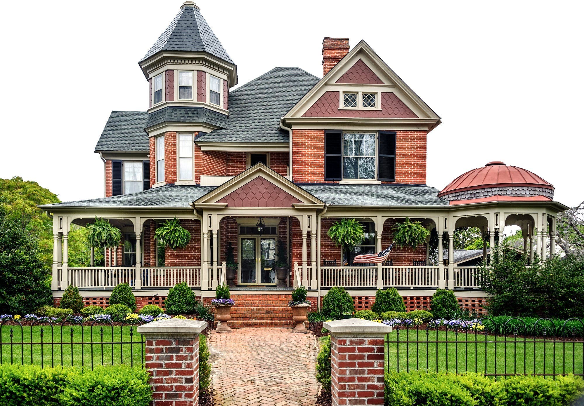 A picture of the exterior of a large historic Victorian house.