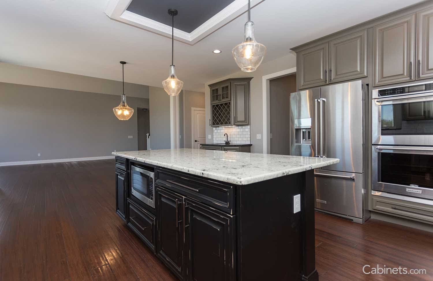 Maple creek stone cabinets with black island cabinets 