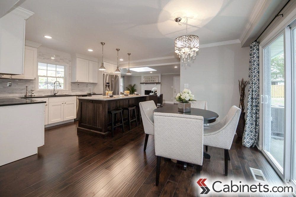 A bright and airy kitchen using our Deerfield Assembled Cabinets in Shaker Maple Bright White