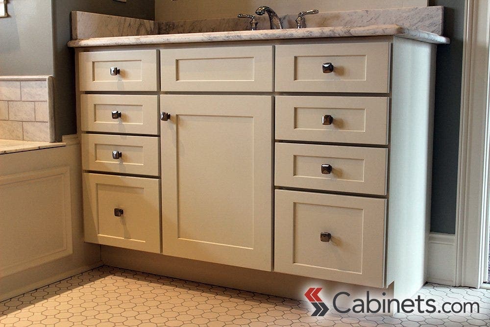 Our customer chose all white finishes for their bathroom, including our Titusville RTA Shaker Maple White cabinets. All white helps give the illusion of more space.