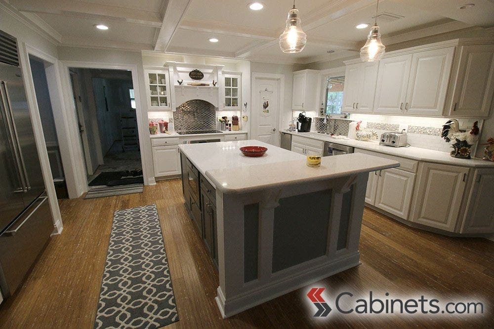 This kitchen showcases a quartz countertop made to mimic marble.