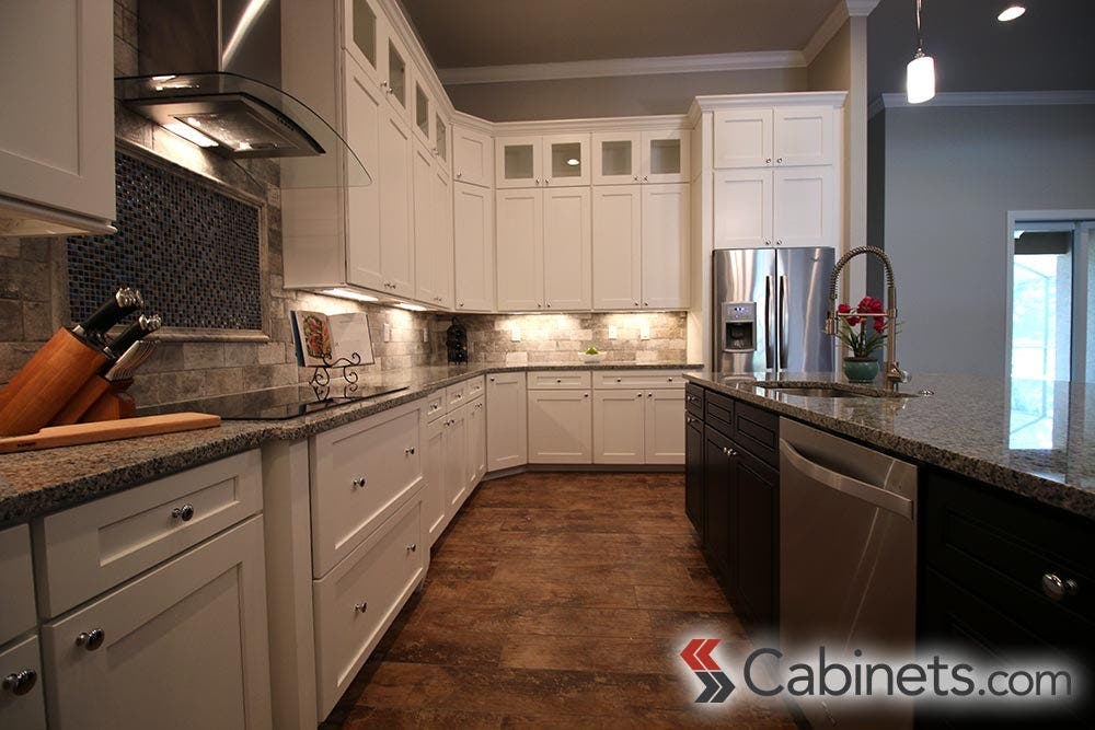 One customer added small glass-front upper cabinets; a great addition to our Deerfield Shaker II Maple Bright White cabinets.