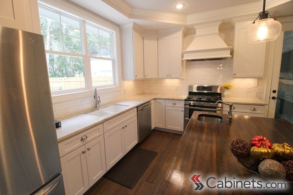 All white cabinets, like these Titusville Shaker Maple White cabinets, are a great backdrop for any design!