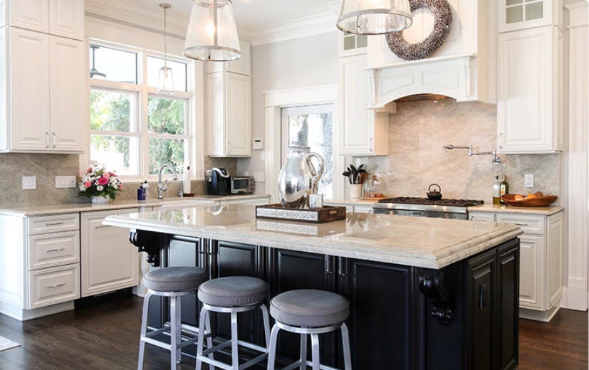 Traditional kitchen design with contrasting
                        light and dark cabinets