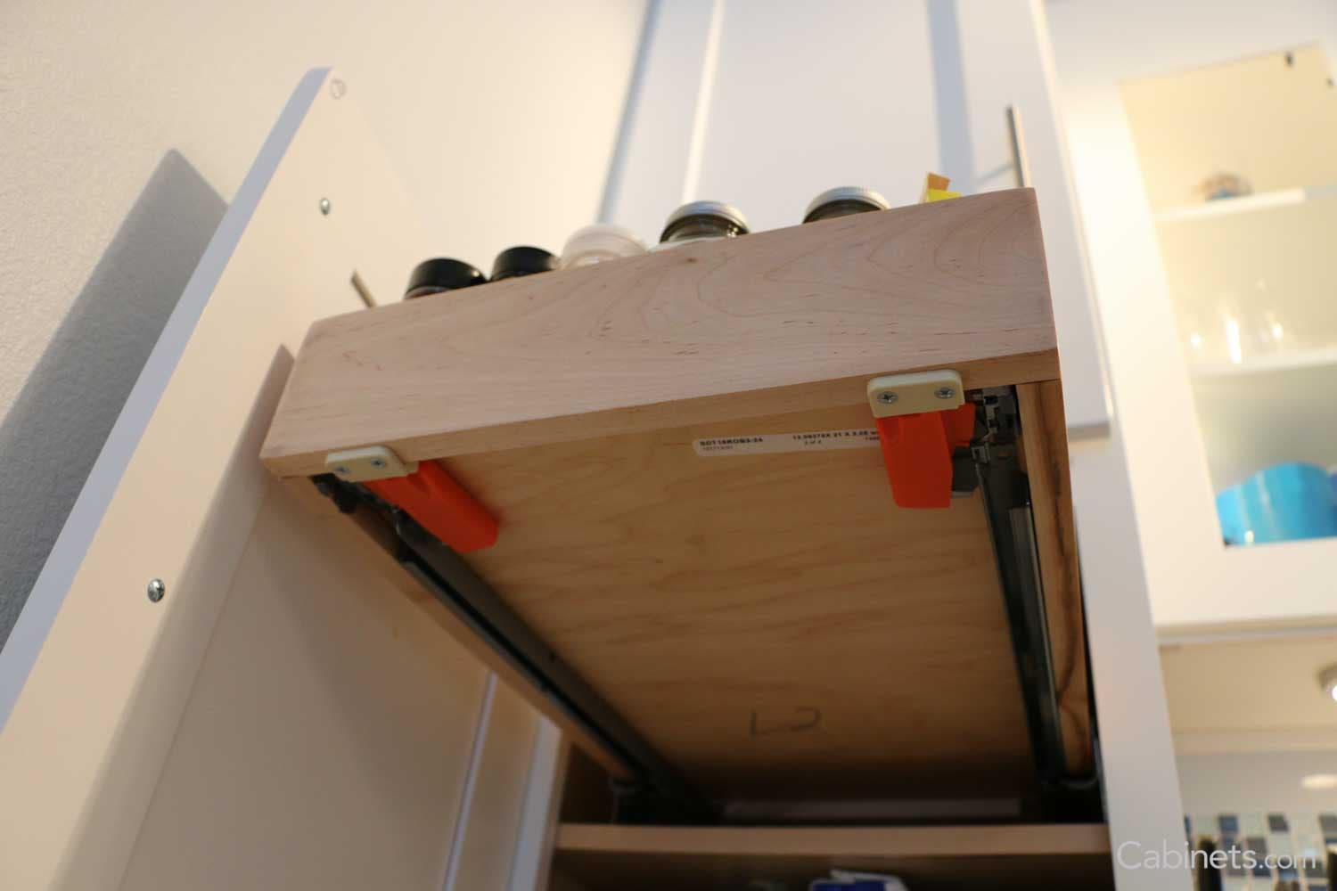 soft close drawer glides shown on cabinet roll out tray