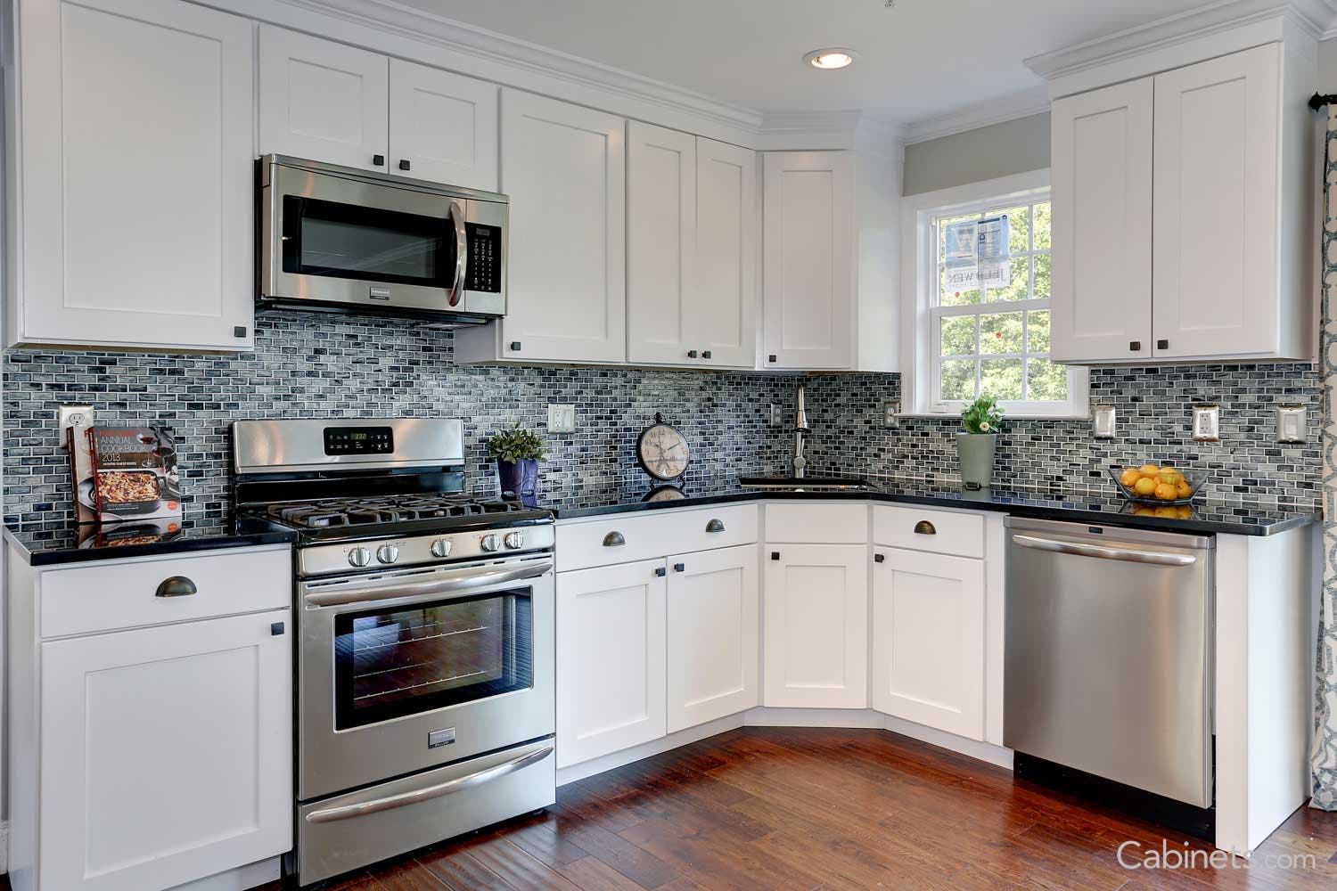 white coastal kitchen featuring the popular shaker style, flat panel cabinet door